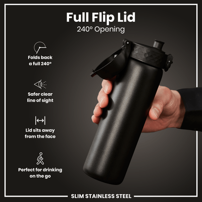 A black, slim stainless steel water bottle with a full flip lid is held; the lid opens 240 degrees. The bottle is shown against a dark grey background.