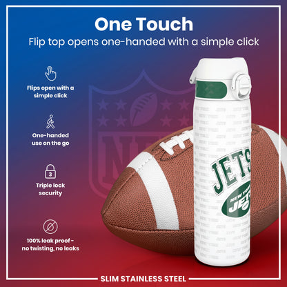 A water bottle, featuring a flip top that opens one-handed, rests near an American football. The bottle is slim, stainless steel, and leakproof. The bottle's design includes the New York Jets logo.