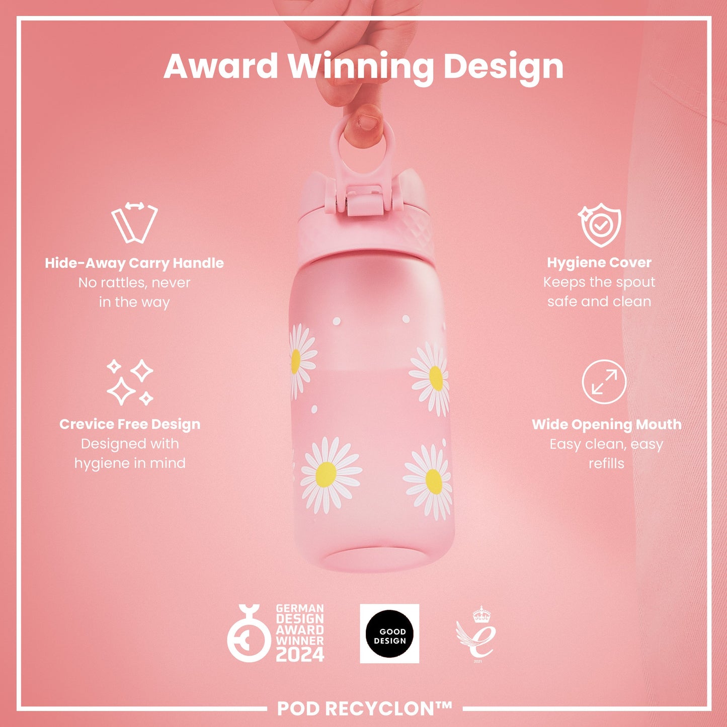 A pink water bottle, decorated with daisies, is being held. It features a hide-away handle, hygiene cover, and wide mouth. The bottle is an award-winning design.