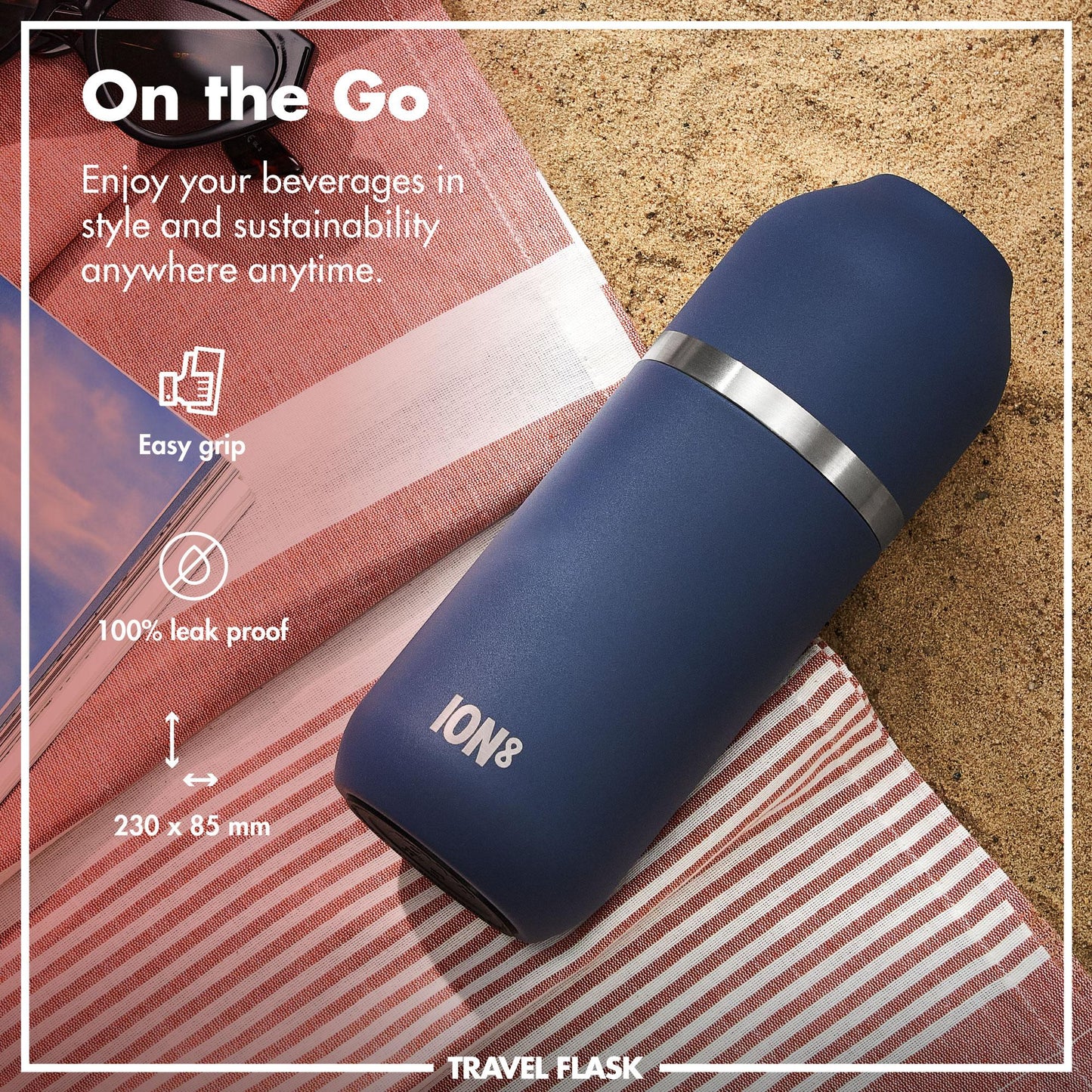 A blue ION8 travel flask lies on a striped cloth beside sunglasses on sand Text: "On the Go Enjoy your beverages in style and sustainability anywhere anytime Easy grip 100% leak proof 230 x 85 mm"