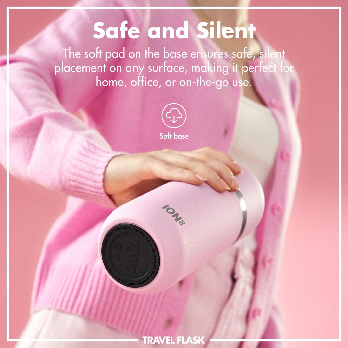 A person holds a pink travel flask with "ION8" branding against a pink background. Text reads: "Safe and Silent. The soft pad on the base ensures safe, silent placement on any surface, making it perfect for home, office, or on-the-go use. Soft base. TRAVEL FLASK."