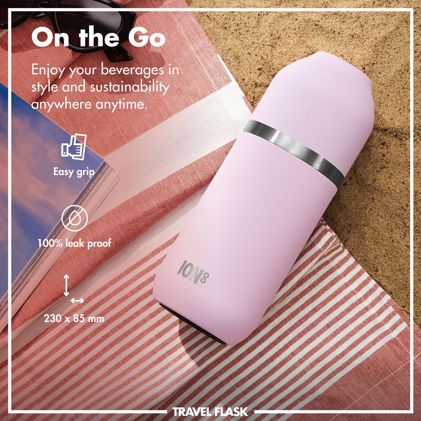 A pink travel flask with a black band rests on a red-striped towel by the sand. Text: "On the Go. Enjoy your beverages in style and sustainability anywhere anytime. Easy grip. 100% leak proof. 230 x 85 mm. ION8. TRAVEL FLASK."