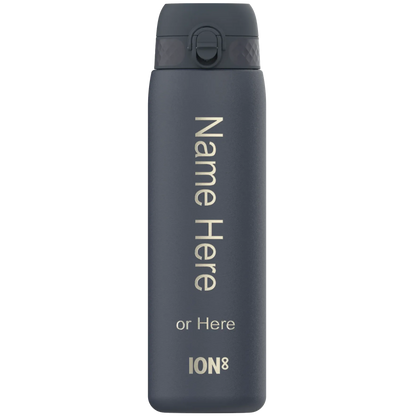 A dark gray water bottle stands upright featuring a flip-top lid. The text reads Name Here or Here ION8 on its surface showing it in a customizable context.